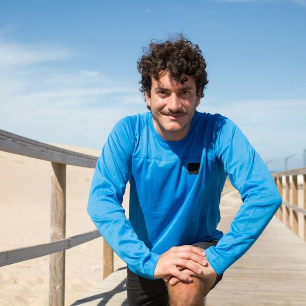 Man stretching outdoors feeling refreshed and energetic.
