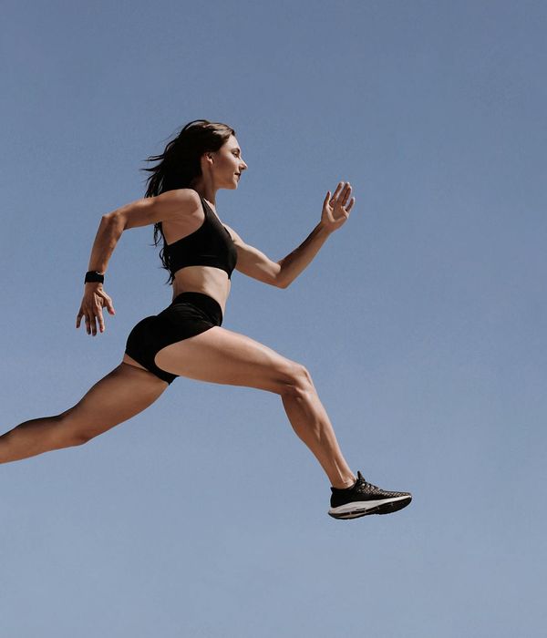Woman in activewear feeling energetic after a workout.